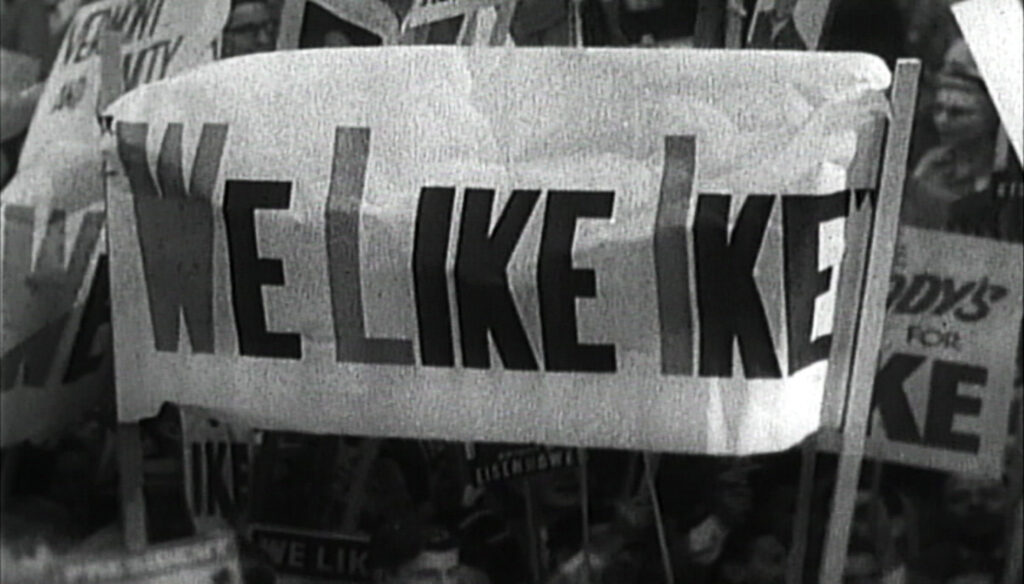 A banner with the words 'WE LIKE IKE' in black lettering on a white background.
