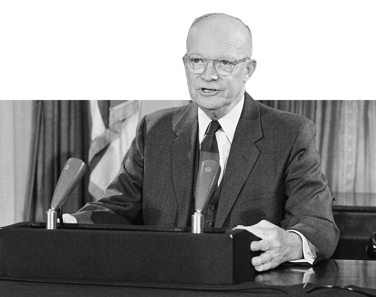 Dwight D. Eisenhower giving a speech at a podium.