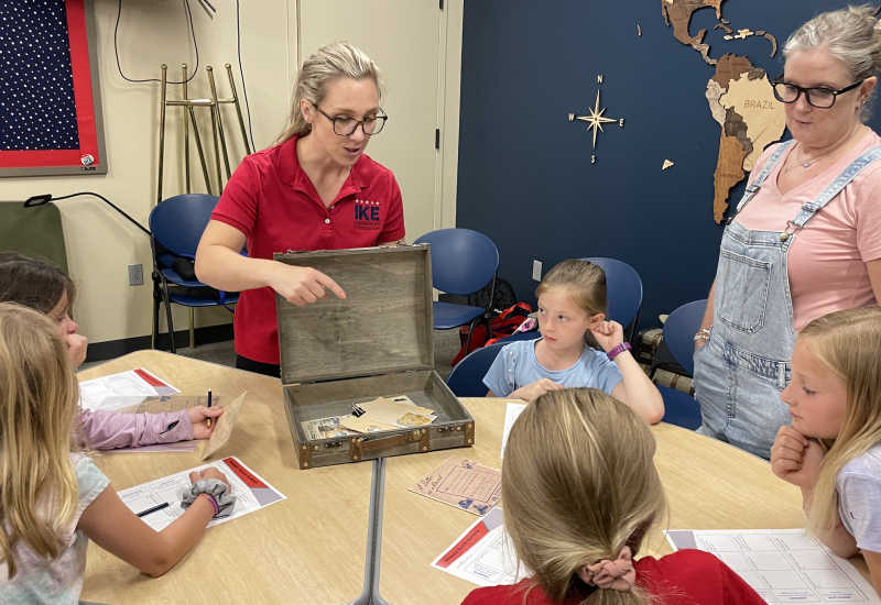 Educator speaking to students during an on-site field trip.