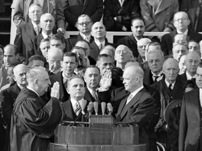 Dwight D. Eisenhower stands among officials during his presidential inauguration.
