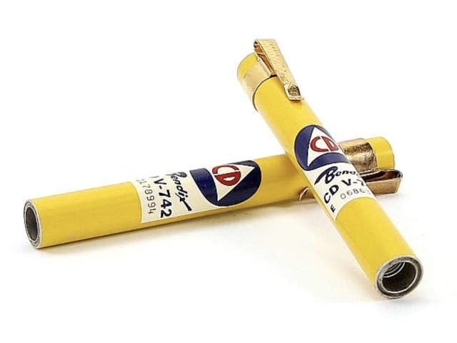 Two yellow civil defense dosimeter pens used to measure radiation exposure.