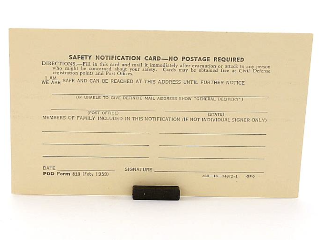 Civil Defense safety notification card with fields for confirming a family is safe and providing a temporary address.