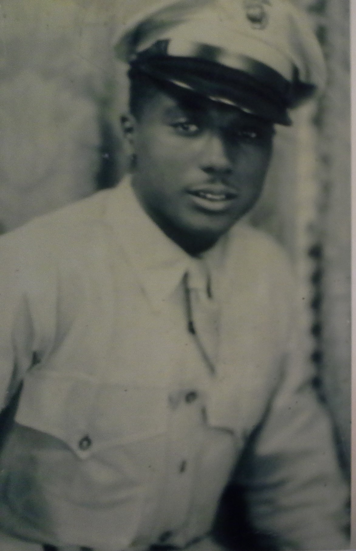 Young man shown in a faded formal portrait.