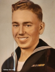 Smiling young serviceman shown in a colorized portrait.