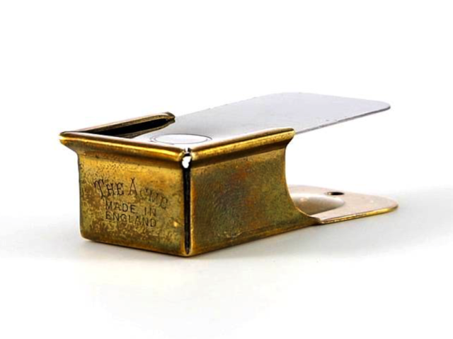 Metal handheld military signaling clicker with a hinged top.