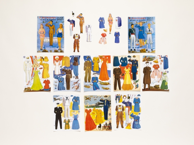 Sheet of illustrated wartime paper dolls with interchangeable clothing.
