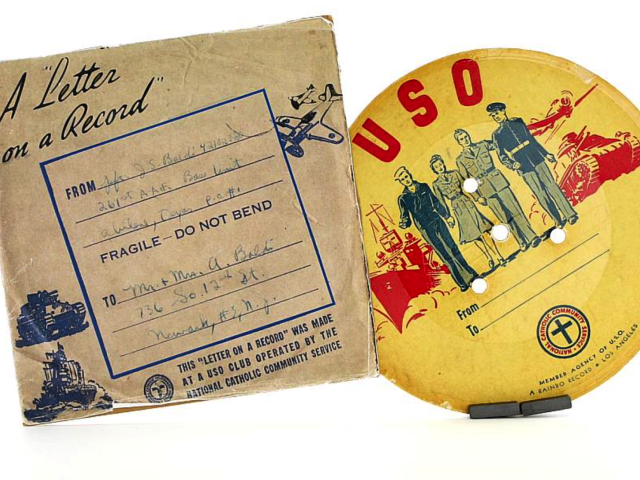 Handwritten letter displayed beside a colorful 45 rpm record sleeve.