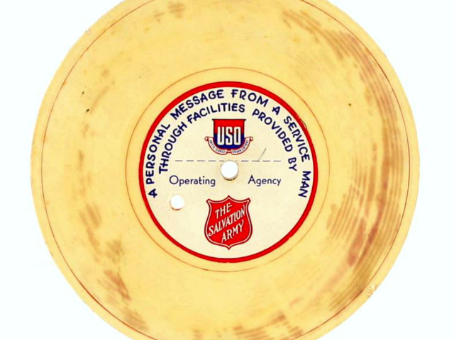 Round wartime recording labeled “A Personal Message from a Service Man.”