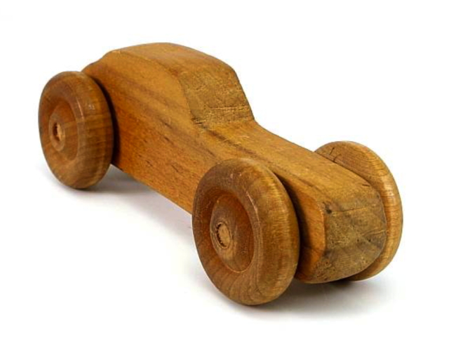 Small wooden toy car with rounded wheels.