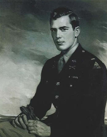 black and white portrait of an American soldier in military attire sitting with hands clasped, wearing medals on his uniform.