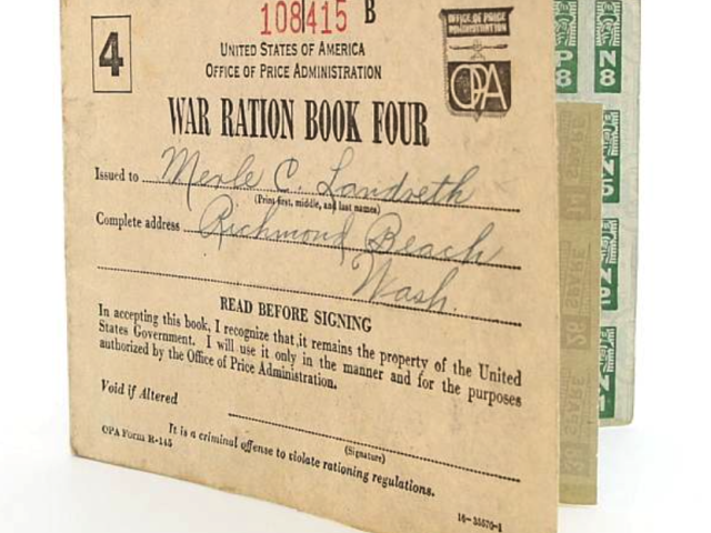 Cover of United States War Ration Book Four with handwritten identification details.