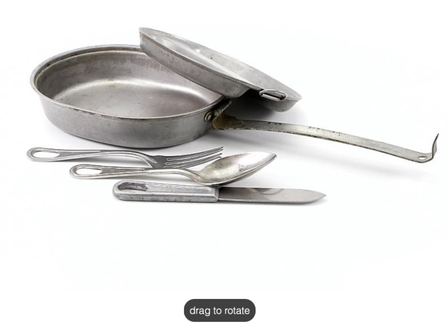 Metal military mess kit displayed with utensils.