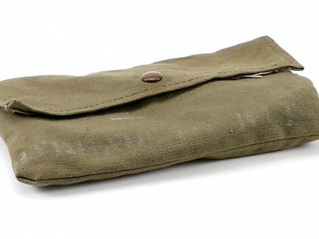 Green canvas case that stores a military hydraulic repair kit.