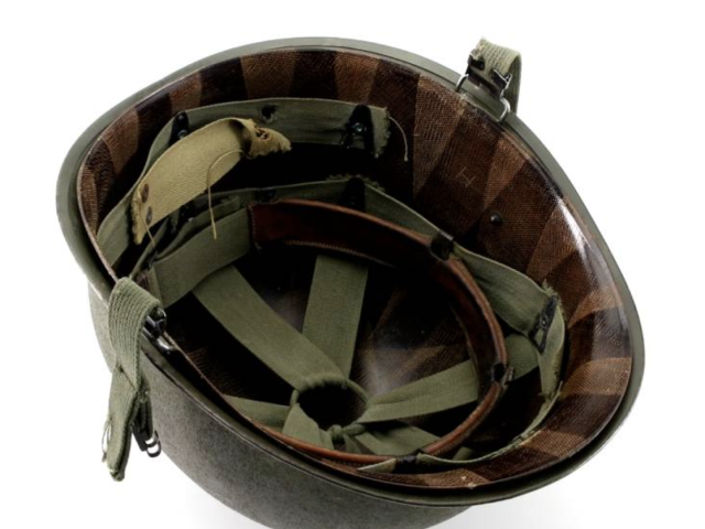 Military steel helmet shown with its removable padded liner and interior straps.