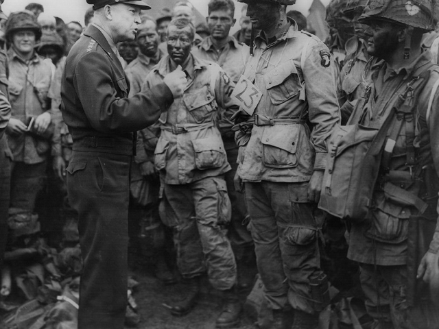 General Dwight D. Eisenhower speaking with paratroopers before the D-Day invasion.