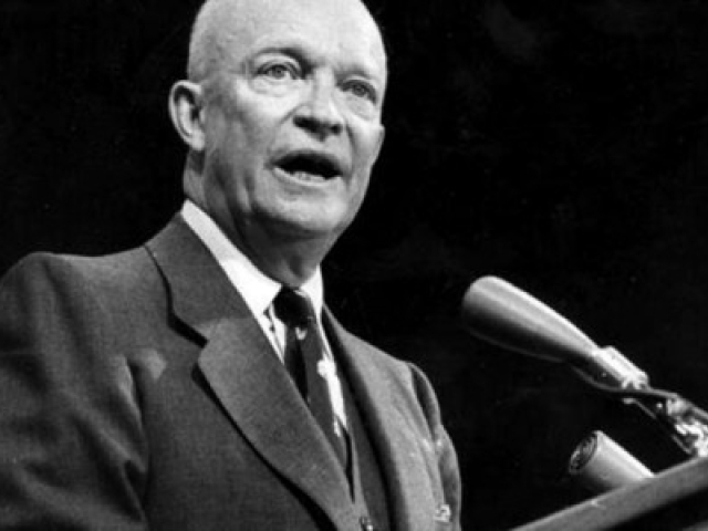 Dwight D. Eisenhower speaking into a microphone.