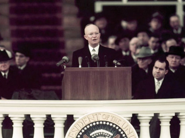 President Dwight D. Eisenhower delivering his first inaugural address at a podium.