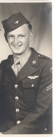 Serviceman wearing a military uniform with pilot wings.