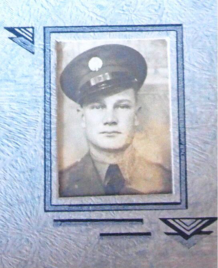 Raymond Ascher shown in a framed military portrait.