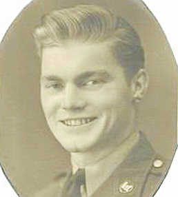 Smiling young serviceman shown in a formal portrait.