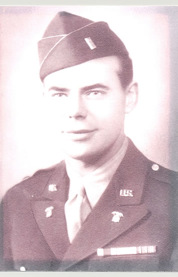 Young serviceman wearing a military uniform and garrison cap.