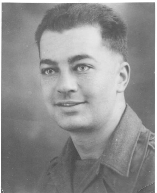Young man shown in a close-up black-and-white portrait.