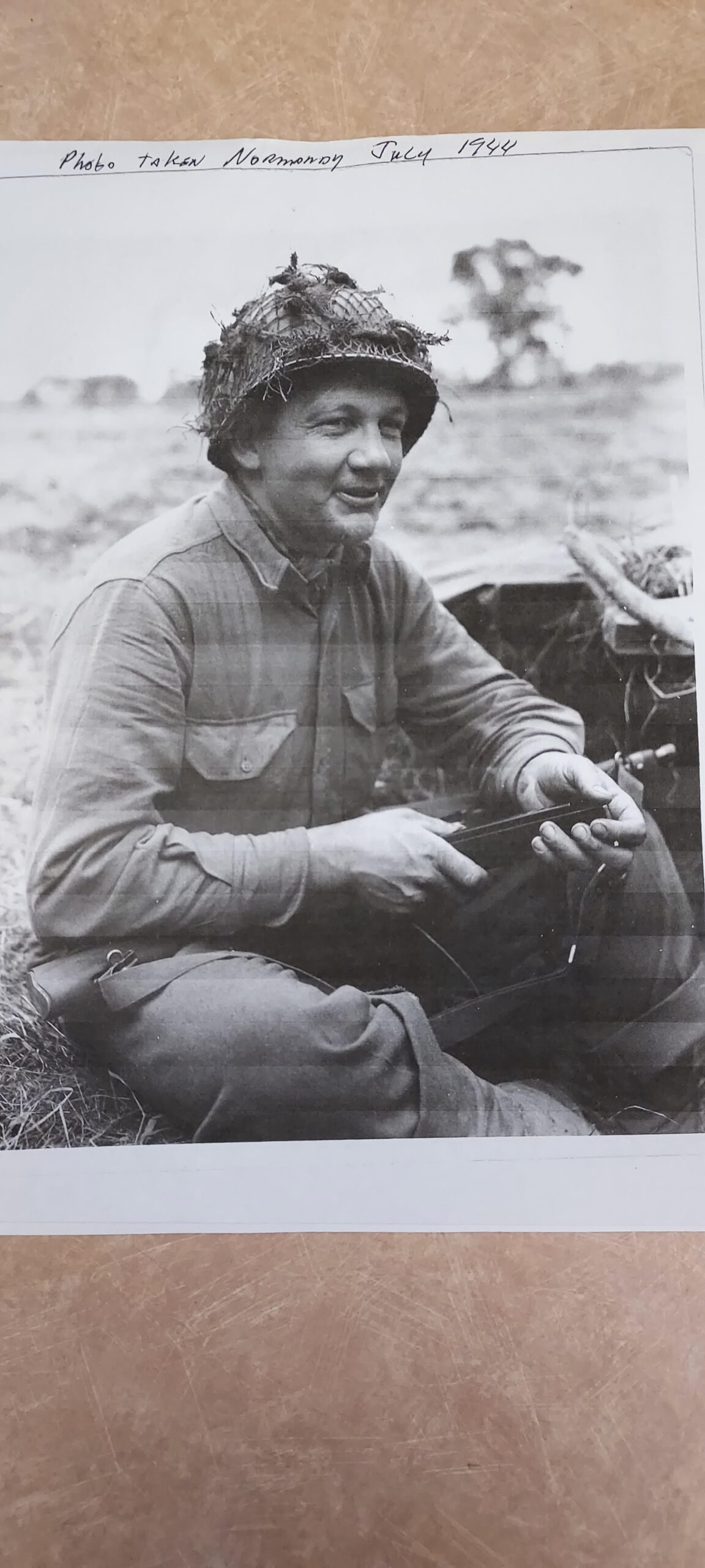 The image displays a black-and-white photograph of a soldier. They seem to be on the field, rather than posing for an official portrait.