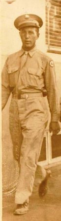 Raymond A. Bourne standing in a light-colored military uniform.