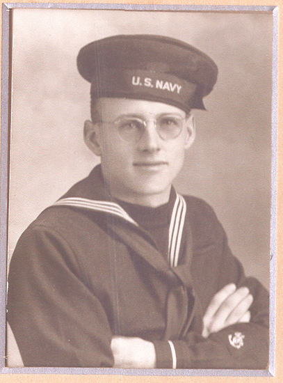 Boyles Leslie wearing a dark U.S. Navy uniform and cap.