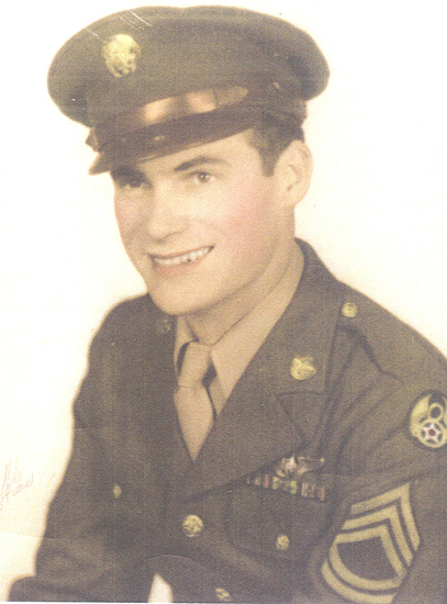 Smiling Brennan wearing a U.S. Army uniform and peaked cap.