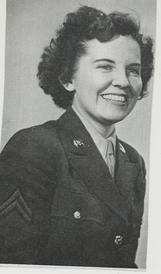 Smiling woman wearing a women’s military uniform.