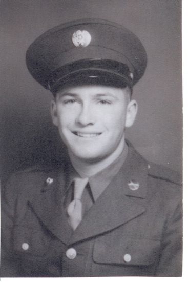 Young man in military uniform with cap, posing in portrait.
