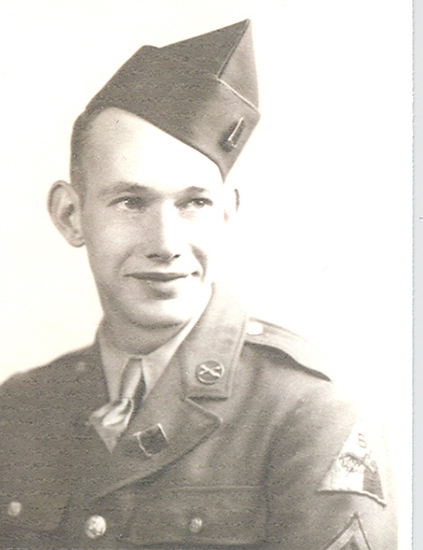 Young serviceman wearing a military uniform and garrison cap.