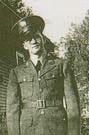 Robert Byrne standing outdoors in an Army medical uniform.