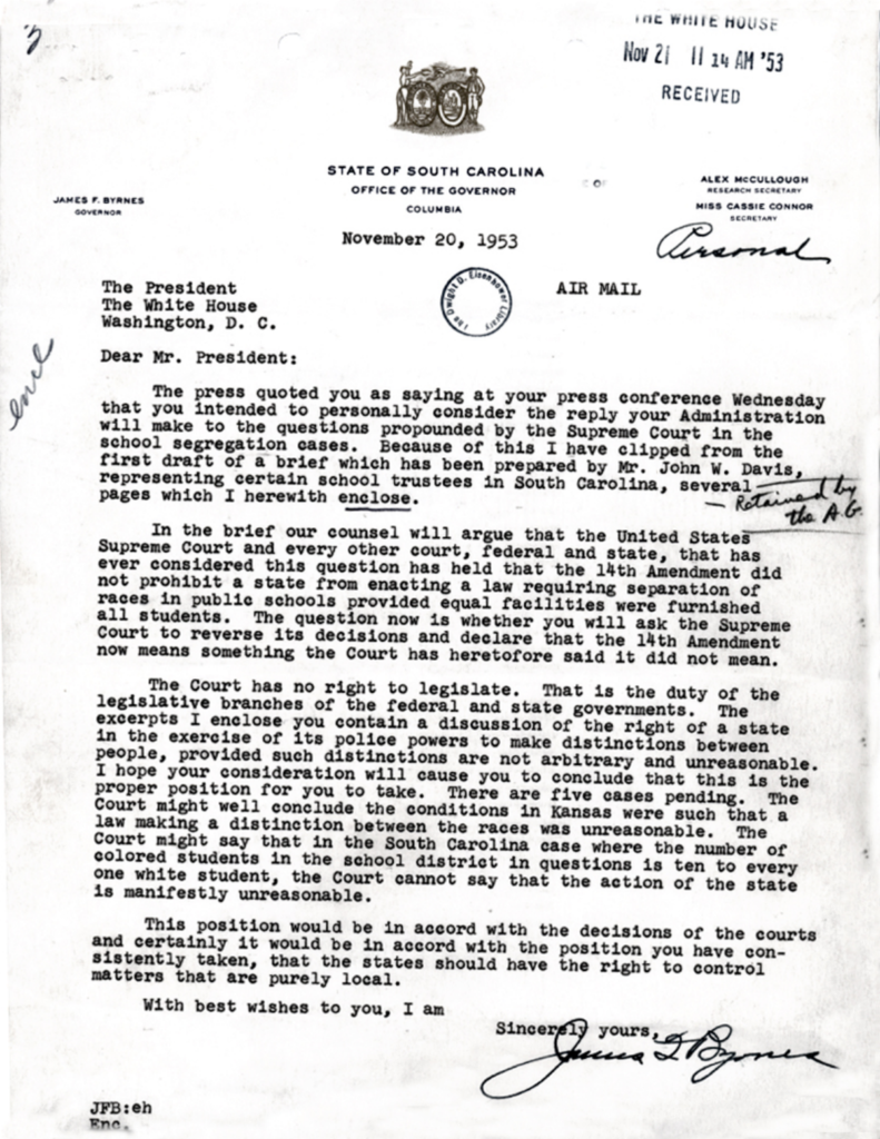 Scanned typewritten letter with official stamps and a signature.