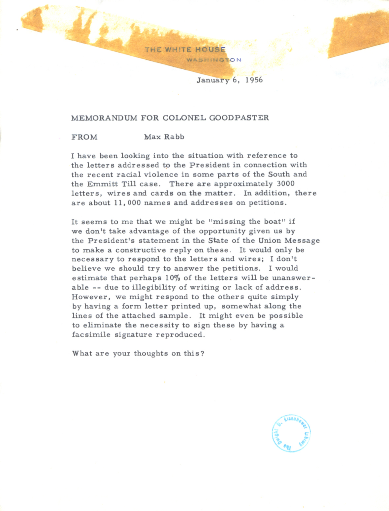 Scanned memorandum with dense text, an orange tab, and an official stamp.