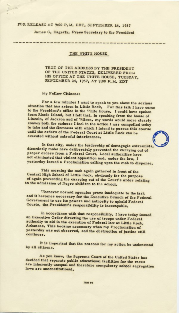 Aged press release with typed text and a blue circular stamp.