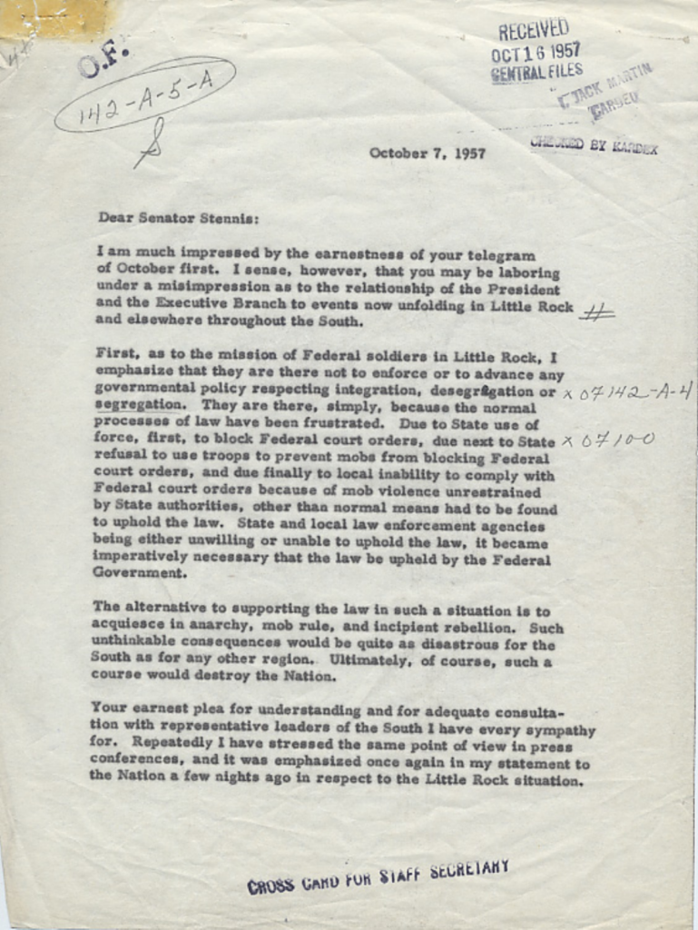 Aged typewritten letter with an official stamp and signature.