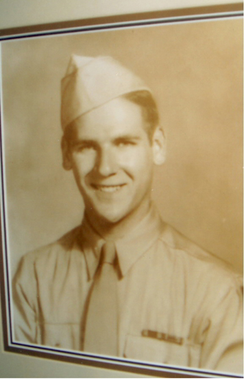 A sepia-toned photo features a person in military uniform with a cap and medal, smiling at the camera. The individual has short hair and is captured from the chest up.