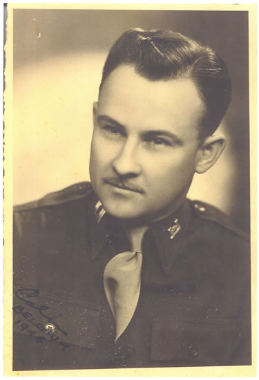 This is an antique black-and-white photo of a man who appears to be a military officer, wearing what seems to be a tie, uniformed shirt and jacket. He has short hair and his expression is serious.