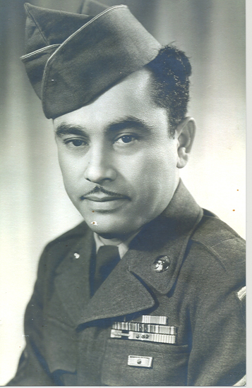 Serviceman Cervantes wearing a military uniform and garrison cap in a formal portrait.