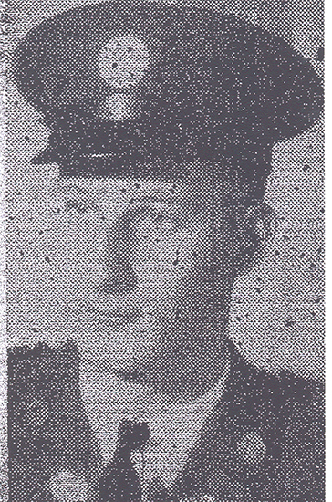 The image is black and white and shows a soldier in uniform.