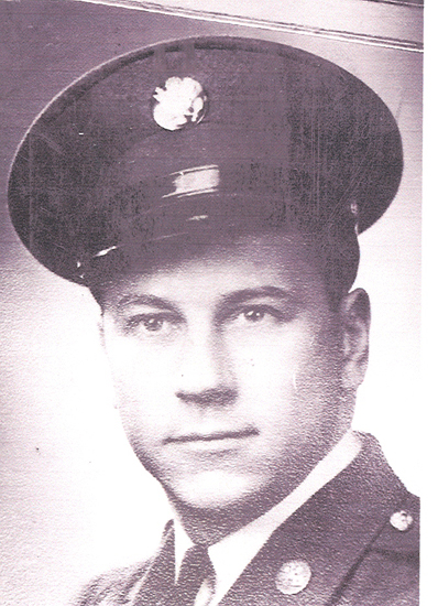 Young serviceman wearing a military uniform and peaked cap.