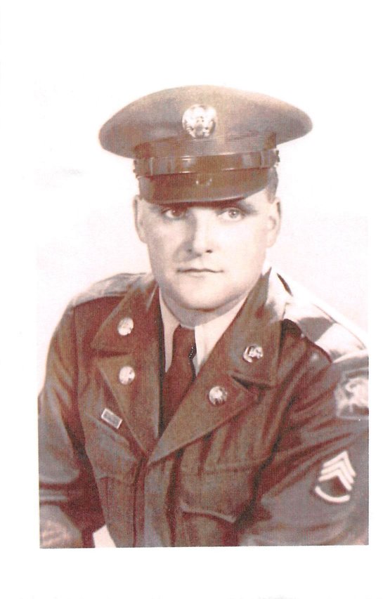 Harold Debenham wearing a military uniform and peaked cap.
