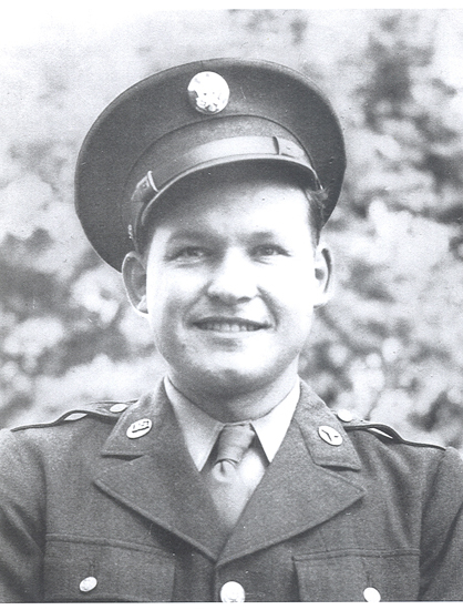 A man in military uniform. He is looking directly at the camera with a slight smile.