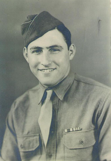 Smiling young serviceman wearing a military uniform and cap.