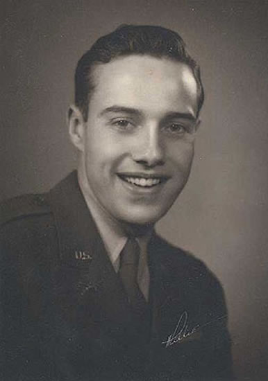 Smiling young serviceman wearing a military uniform.