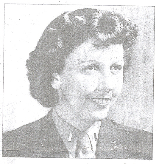 Smiling woman shown in a formal black-and-white portrait.