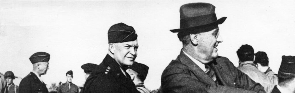 Dwight D. Eisenhower speaks with President Franklin D. Roosevelt.