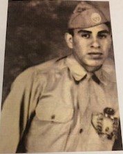 Eli Hernandez wearing a military uniform and garrison cap.